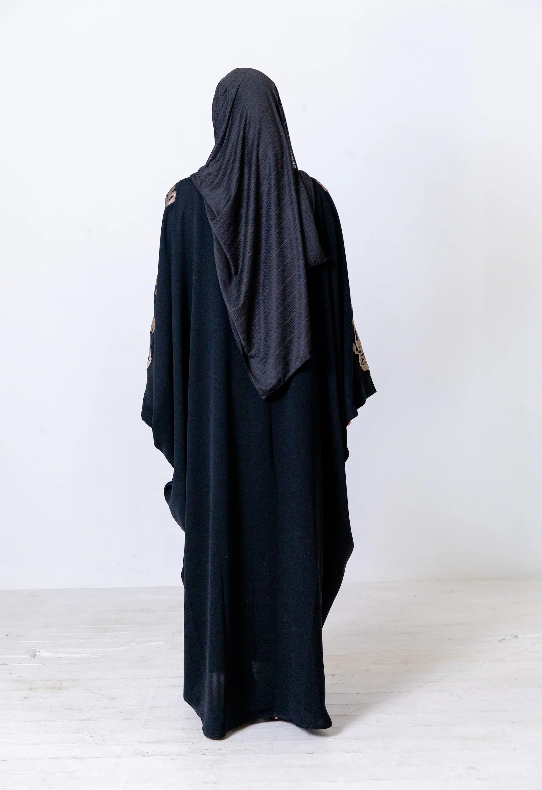 Black Closed Abaya – Luxurious Batwing Design with Gold Front and Sleeve Embroidery - Image 6